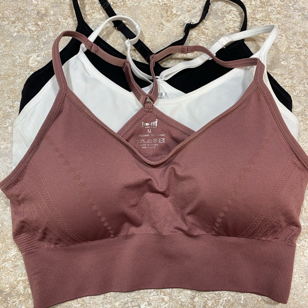 3-Pro-Fit outfitters Women's Seamless Bralette Set - Black, White, and Mauve.